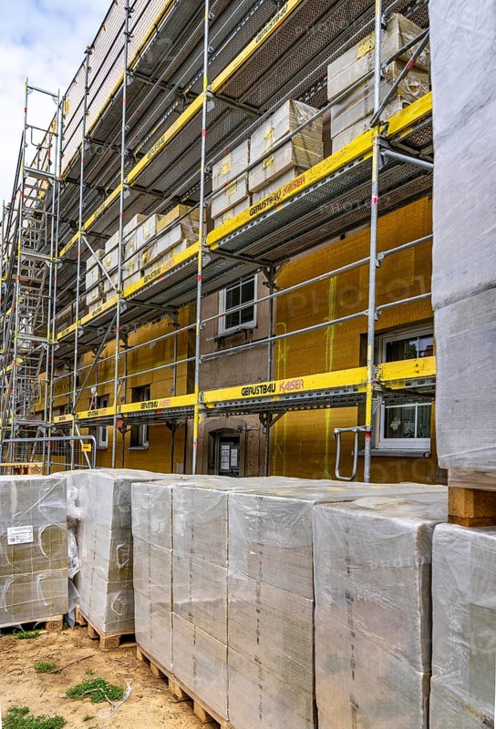 Energy refurbishment of an older residential building, thermal insulation with mineral wool insulation boards, mounted on the façade and then plastered, North Rhine-Westphalia, Germany
