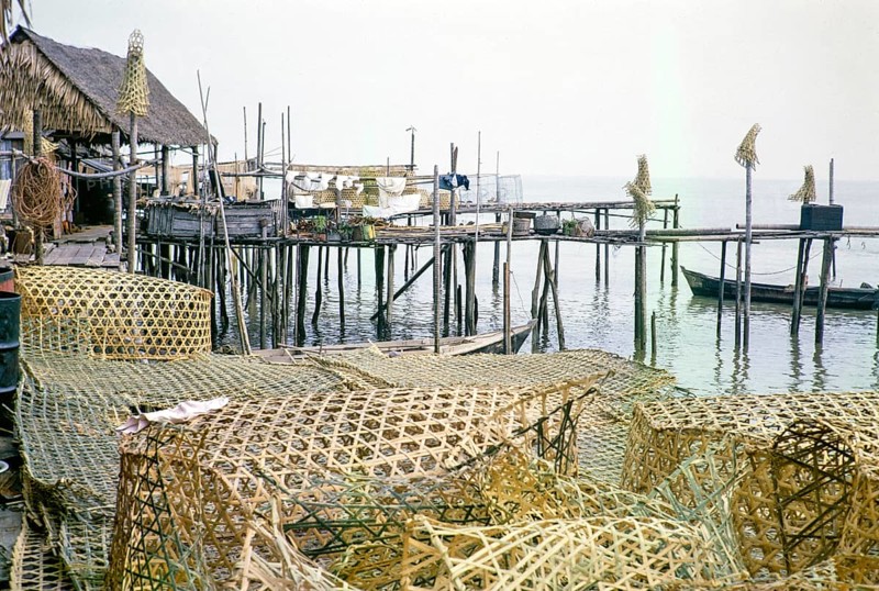 Wicker fish traps and wooden jetties in fishing village on stilts, Singapore, southeast Asia 1963