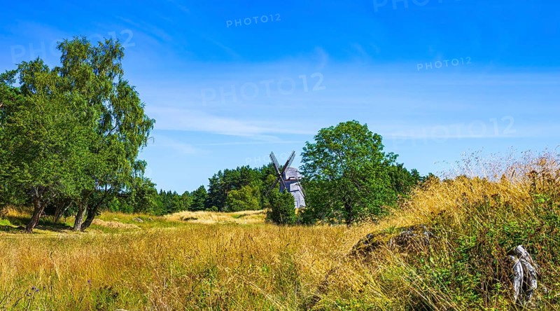 Epic summer landscape with historic windmill near the burial ground of Stenhusbacken and the village of Sunnersberg near Lidköping, Västergötland, Västra Götalands län, Sweden