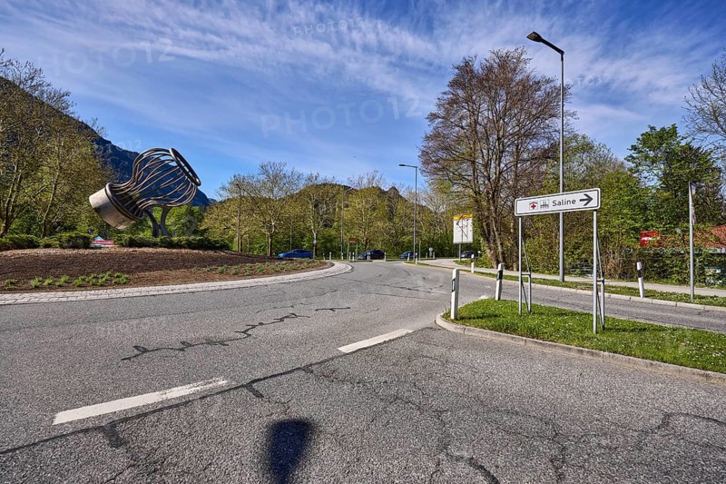 Salt works roundabout, stainless steel sculpture salt shaker, signpost to the salt works, streets, lantern, traffic island, trees, blue sky, cirrostratus clouds, roundabout, federal highway 20, Reichenbacher Straße, Bad Reichenhall, district Berchtesgadener Land, Bavaria, Germany
