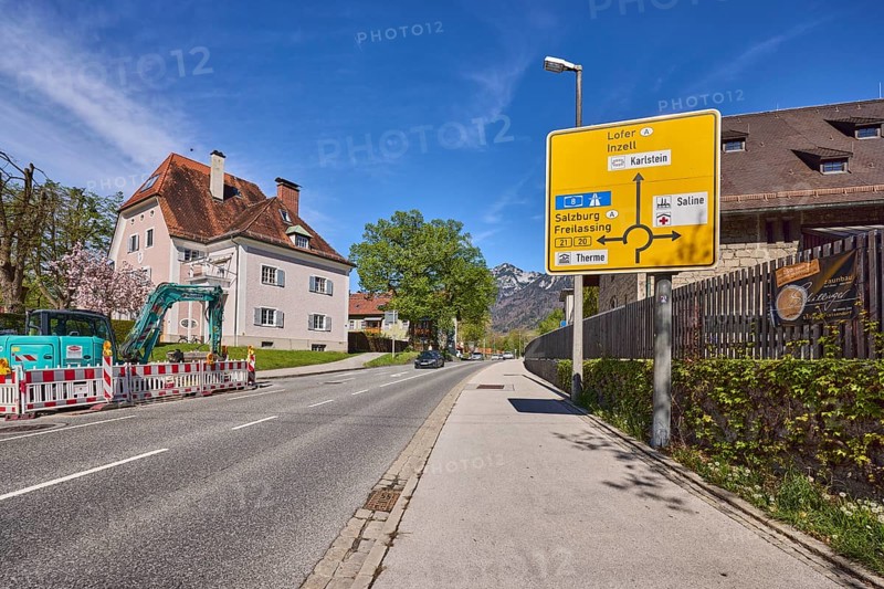 Signposts to Lofer, Inzell, Salzburg and Freilassing, road, house, lantern, trees, lawn, fenced-off building site, wall, wooden fence, blue sky, cirrostratus clouds, Reichenbachstraße, Bad Reichenhall, Berchtesgadener Land district, Bavaria, Germany