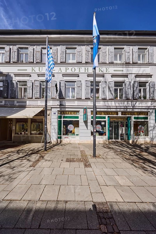 Kur-Apotheke, historical pharmacy, building, flagpoles, flags, facade, windows, entrance, doors, blue sky, cirrostratus clouds, Ludwigstraße, Bad Reichenhall, district Berchtesgadener Land, Bavaria, Germany