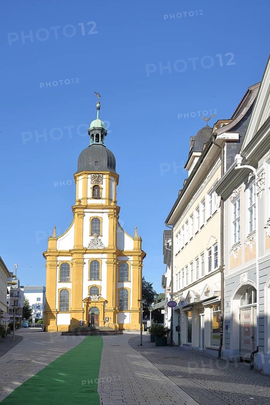 Baroque cruciform church with green carpet, houses, stony path, Suhl, Franconia, Thuringia, Germany