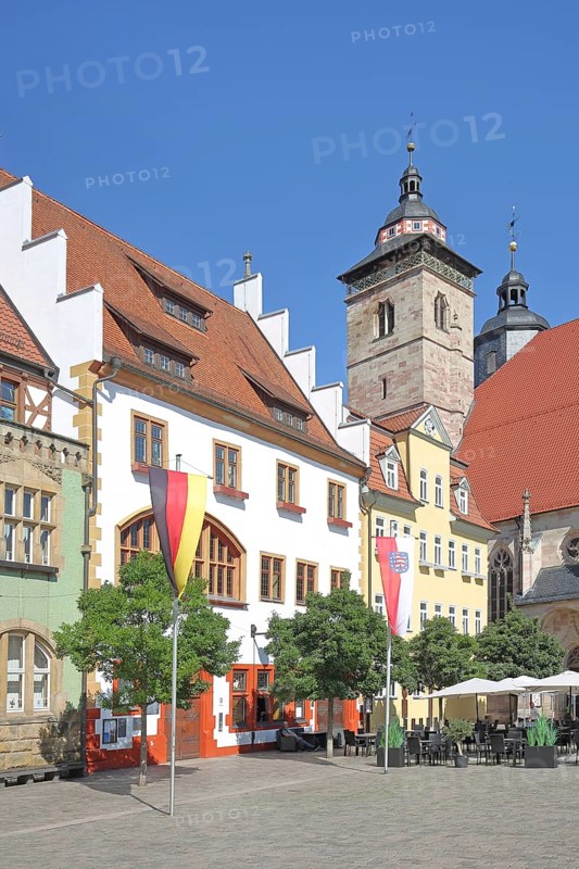 Houses and German national flag with Thuringian state flag, St George's Church, Altmarkt, Schmalkalden, Franconia, Thuringia, Germany
