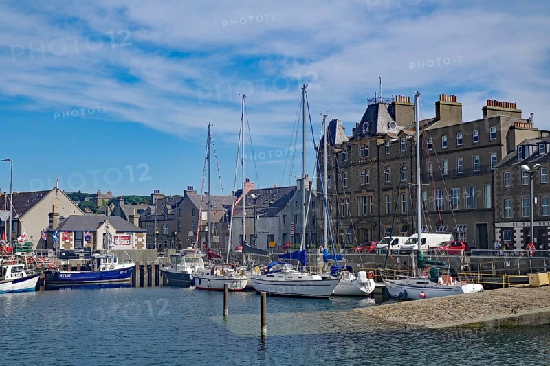 Coastal harbour with sailing boats and historic buildings under a bright blue sky, Kirkwall, Orkney Islands, Scotland, Great Britain