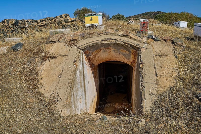 Lost Place, concrete bunker entrance in dry landscape under blue sky with vegetation, Italian air defence position, ground defence position, PL306 with 6 cannons, WW2, Vigla Mountain, Vigla, above Lakki, Lakki, Leros, Dodecanese, Girechian Islands, Greece