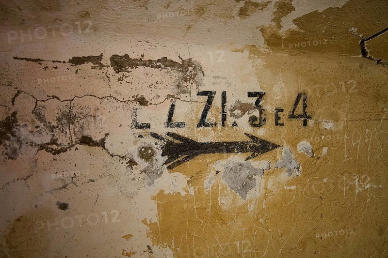 Lost Place, Ruin of a barracks, Patched wall with arrows and numbers in black on yellow, weathered plaster, Italian anti-aircraft position, Ground defence position, PL306 with 6 cannons, WW2, Vigla Mountain, Vigla, above Lakki, Lakki, Leros, Dodecanese, Girech Islands, Greece