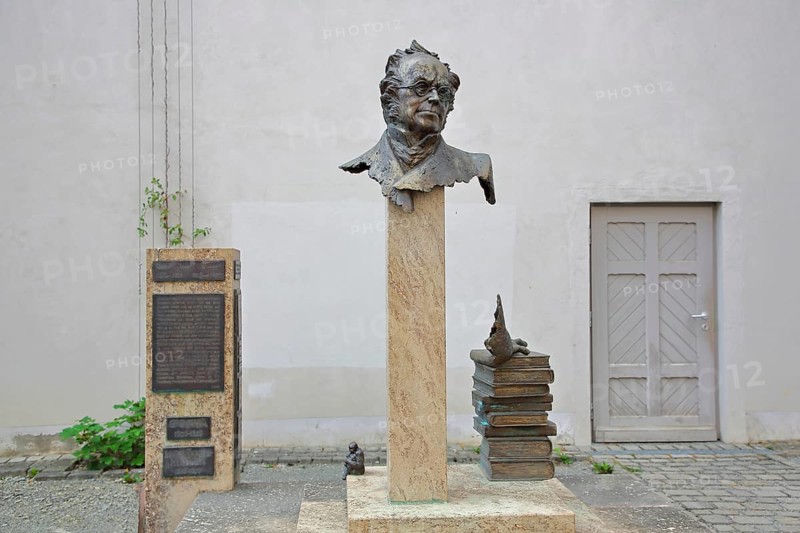 Monument to merchant, publicist and publisher Carl Joseph Meyer, bust, head, sculpture, stele, pile of books, books stacked on top of each other, Hildburghausen, Franconia, Thuringia, Germany