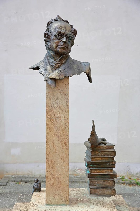 Monument to merchant, publicist and publisher Carl Joseph Meyer, bust, head, sculpture, stele, pile of books, books stacked on top of each other, Hildburghausen, Franconia, Thuringia, Germany