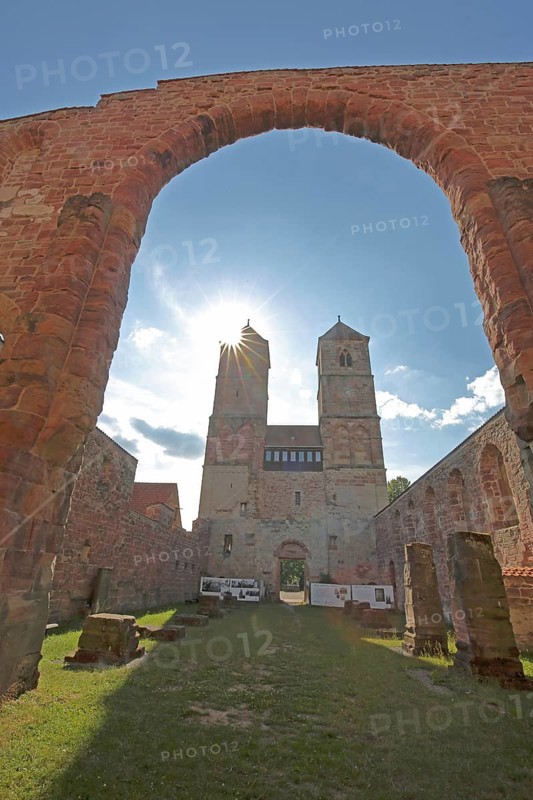 Romanesque St. Mary's Collegiate Church backlit with archway, twin towers, church ruins, interior view, view upwards, museum, Veßra Monastery, cobblestone, Thuringia, Germany