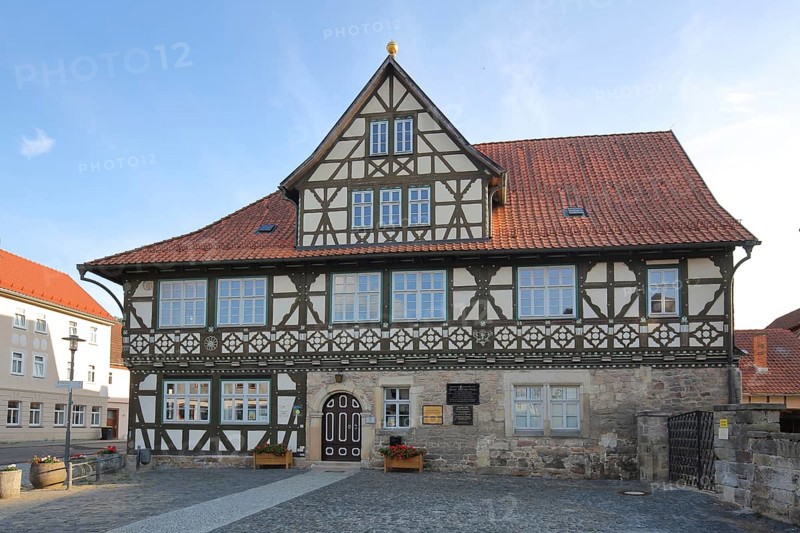 Historic official residence built in 1665, half-timbered house, hipped roof, Themar, fieldstone, Thuringia, Germany