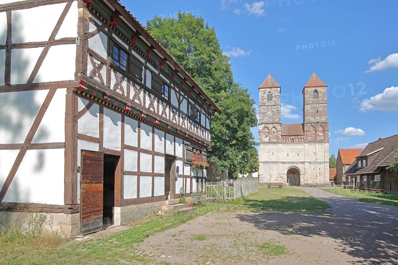 Half-timbered house and Romanesque St Mary's Collegiate Church with twin towers, church ruins, museum, Veßra Monastery, cobblestone, Thuringia, Germany