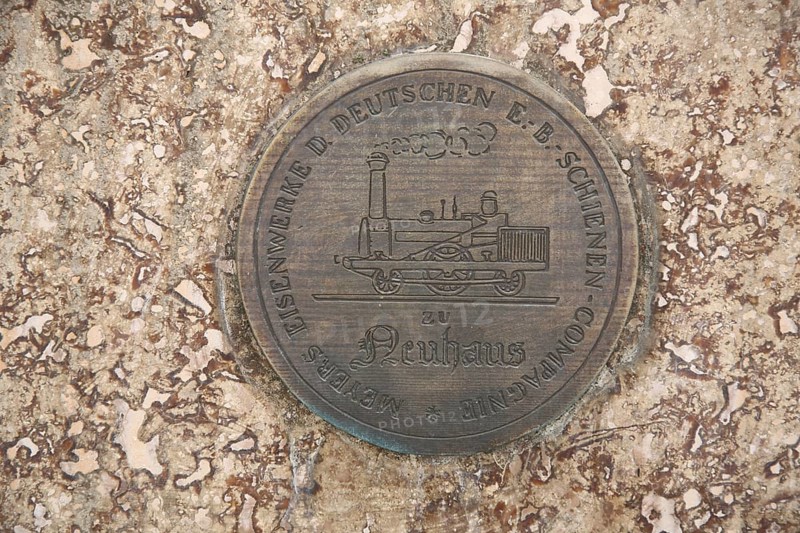 Monument to merchant, publicist and publisher Carl Joseph Meyer, with inscription Meyers Eisenwerk der deutschen Schienen-Kompagne, company, Neuhaus, round, plaque, medallion, embossing, historical locomotive, railway, company, Compagne, Meyer monument, detail, Hildburghausen, Franconia, Thuringia, Germany