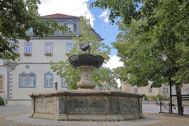 Hennebrunnen fountain with sculpture, bird figure, market square, town hall, Ilmenau, Thuringian Forest, Thuringia, Germany