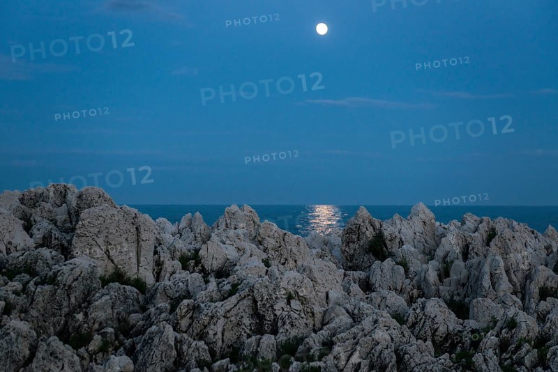 Rocks by the sea and full moon, Cap Martin, near Menton, Alpes Maritimes, Provence Alpes Cote d'Azur, French Riviera, South of France, France