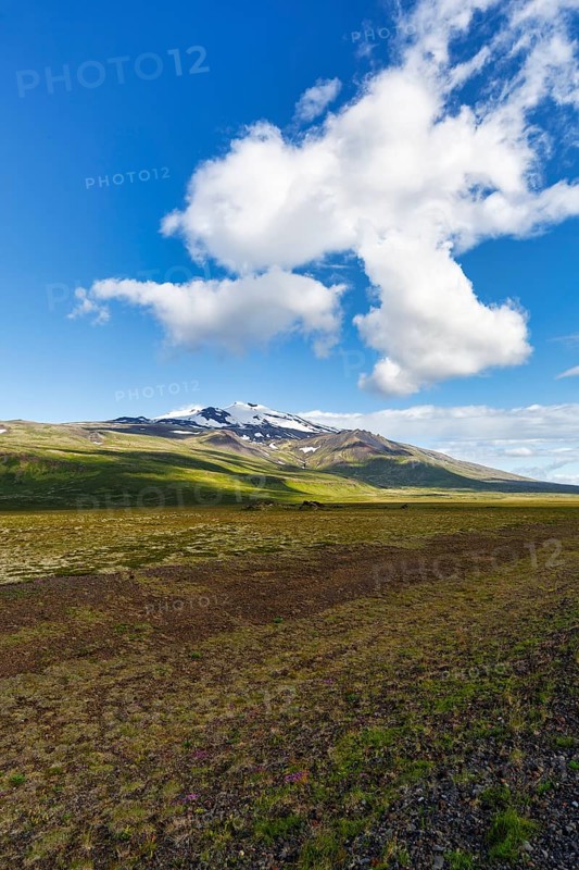 Barren volcanic landscape with a view of the snow-covered Snæfellsjökull volcano, Snäfellsjökull, Snaefellsjökull glacier, spring clouds, Snæfellsnes peninsula, Iceland