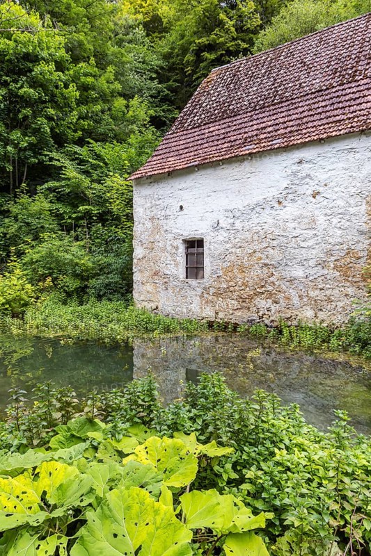 Old barn. The building is located near the source of the Zwiefalter Ach river at the Wimsen Cave excursion destination in the Swabian Alb. Hayingen, Baden-Württemberg, Germany