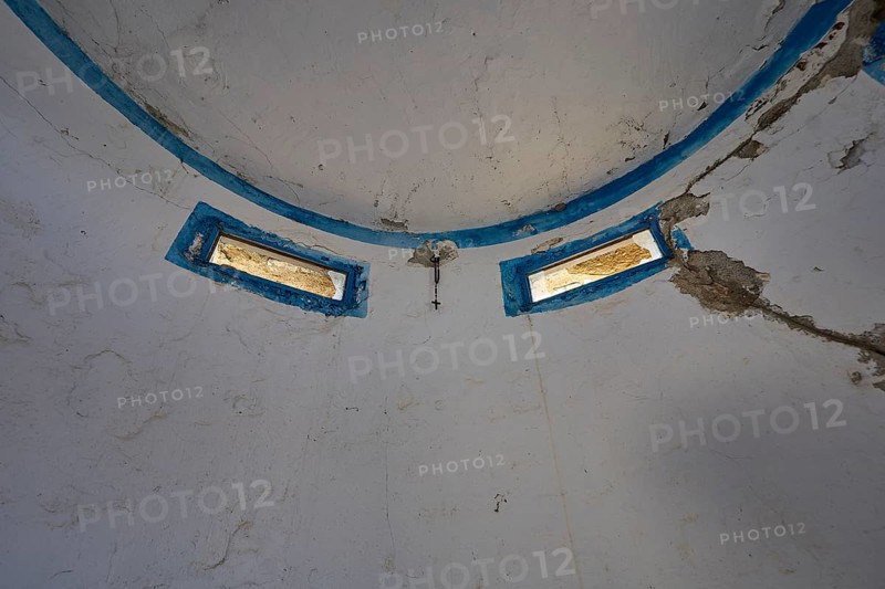 Interior of an abandoned dome with blue window frames and peeling plaster, Lost Place, Lago anti-aircraft battery, bunker, Apitiki Mountain, Leros, Dodecanese, Greek Islands, Greece