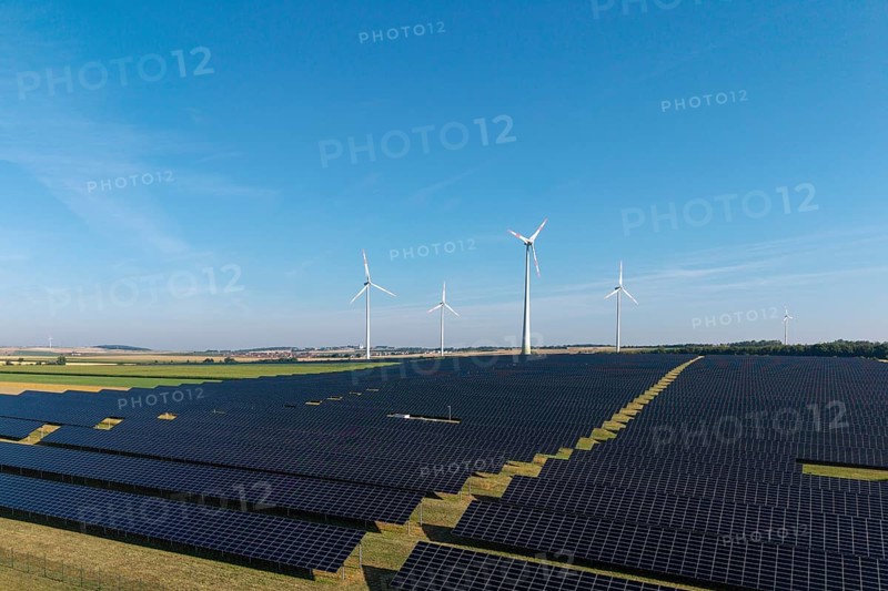 Renewable energy stations with solar panels and wind turbines in an open area, near Kitzingen, Lower Franconia, Bavaria, Germany