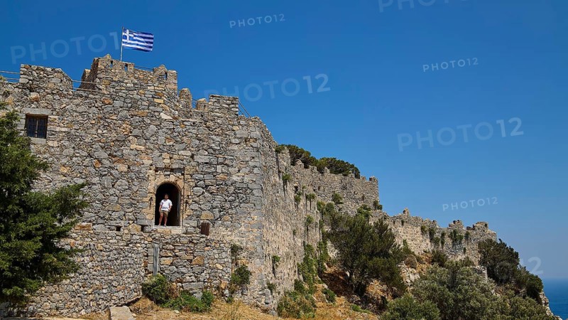 Greek flag flies over Stone Castle, Pandeli Castle, Castle, Leros Fortress, St John's Fortress, Apitiki Hill, Pandeli Bay, Agia Marina, Leros, Dodecanese, Greek Islands, Greece