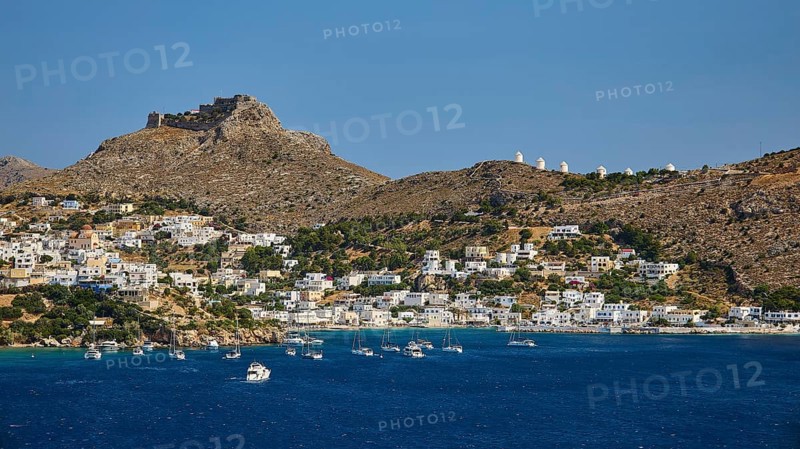 Coastal town on a blue sea with hill and castle in the background, lined with sailing boats, Pandeli Castle, Castle, Leros Fortress, St John's Fortress, Apitiki Hill, Pandeli Bay, Agia Marina, Leros, Dodecanese, Greek Islands, Greece
