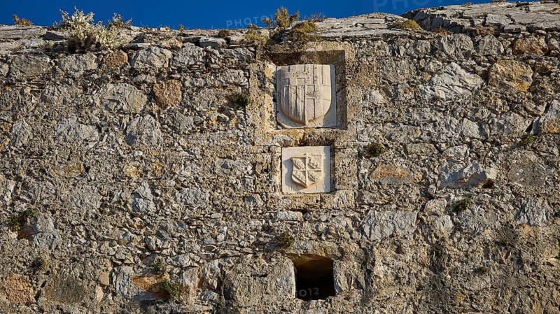 Medieval stone wall with engraved coats of arms and weathered engravings, coat of arms of Emery d'Amboise, Pandeli Castle, Castle, Leros Fortress, St John's Fortress, Apitiki Hill, Pandeli Bay, Agia Marina, Leros, Dodecanese, Greek Islands, Greece