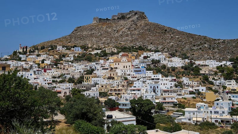 White village on the slope of a rocky mountain under a blue sky, Pandeli Castle, castle, Leros Fortress, St John's Fortress, Apitiki Hill, Pandeli Bay, windmills, Leros, Dodecanese, Greek Islands, Greece