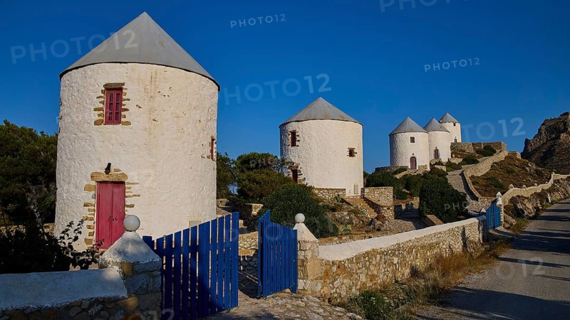 Four windmills behind a blue gate, along a road, Pandeli Castle, Castle, Leros Fortress, St John's Fortress, Apitiki Hill, Pandeli Bay, Windmills, Leros, Dodecanese, Greek Islands, Greece