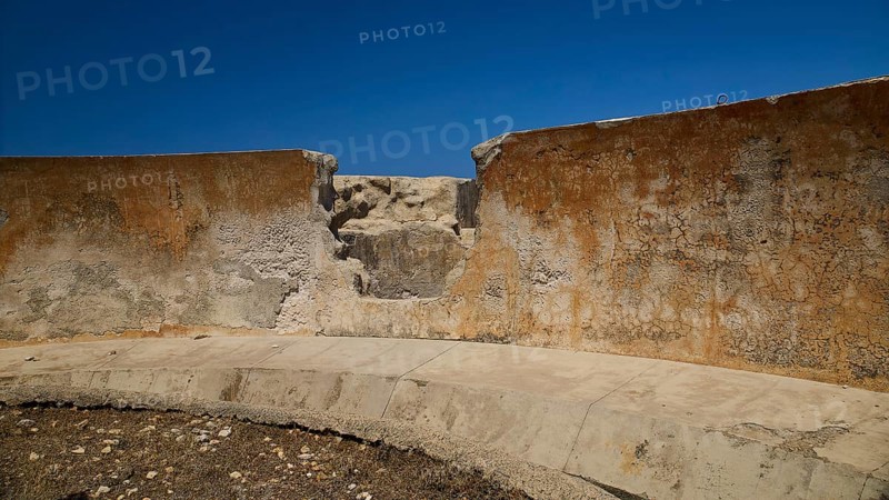 Erosion on concrete wall of an old ruin under blue sky, Lost Place, Air Defence Position, Aerophone, Parabolic Acoustic Mirror, Patella Mountain, WW2, west of Lakki, Leros, Dodecanese, Greek Islands, Greece