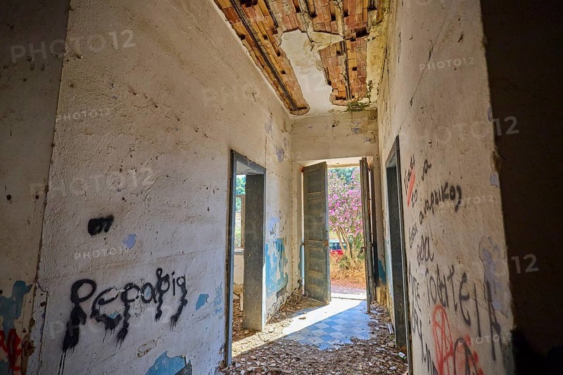 Lost Place, Abandoned hallway with graffiti and open doors, Flooded with light in a dilapidated state, Radio Station, WW2, Agios Nikolaos Radio, Agia Marina, Leros, Dodecanese, Greek Islands, Greece
