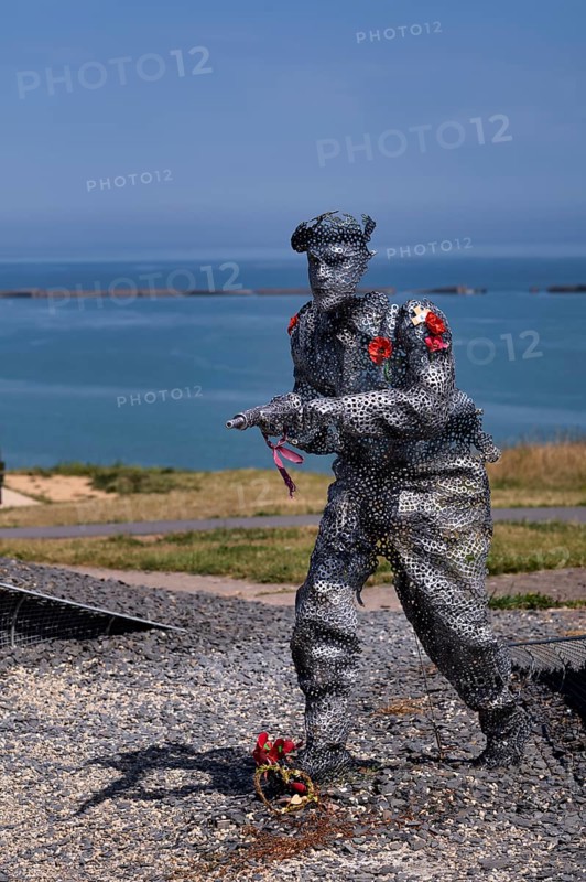Sculpture by Bill Pendell MM, British World War II veteran, looking back at himself and his comrades in the Battle of Gold Beach, D-Day 75 garden, also Le Jardin du Souvenir, D-Day, Operation Overlord, Mulberry B, Mulberry Harbour, Gold Beach, beach, Port Winston, Arromanches-les-Bains, Normandy, Calvados, France