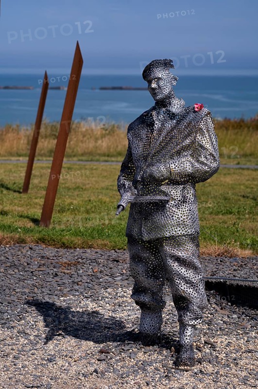 Sculpture by Bill Pendell MM, British World War II veteran, looking back at himself in the Battle of Gold Beach, D-Day 75 garden, also Le Jardin du Souvenir, D-Day, Operation Overlord, Mulberry B, Mulberry Harbour, Gold Beach, beach, Port Winston, Arromanches-les-Bains, Normandy, Calvados, France