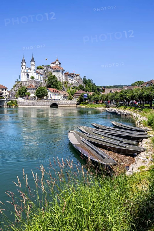 Aarburg town on the River Aare with church, fortress and boats in Aarburg, Switzerland