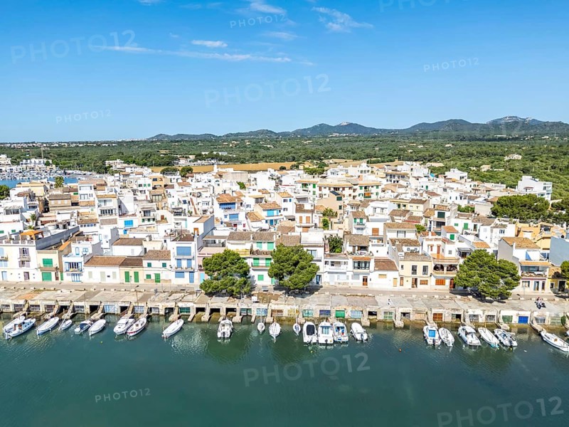 Portocolom fishing village on Majorca aerial view from above with boats holiday by the sea trip in Portocolom, Spain