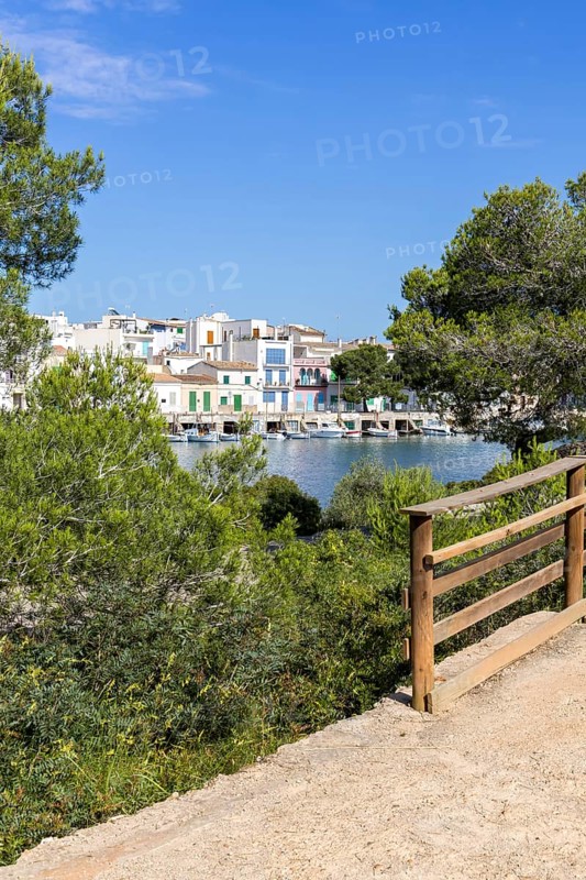 Portocolom fishing village on Majorca with boats and colourful houses Holiday by the sea in Portocolom, Spain