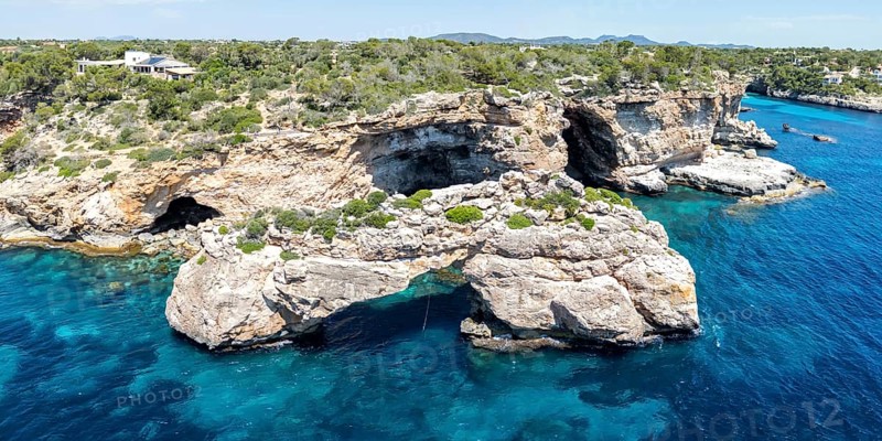 Es Pontas rock gate near Cala Santanyi on the island of Majorca in the Mediterranean panoramic holiday in Santanyi, Spain
