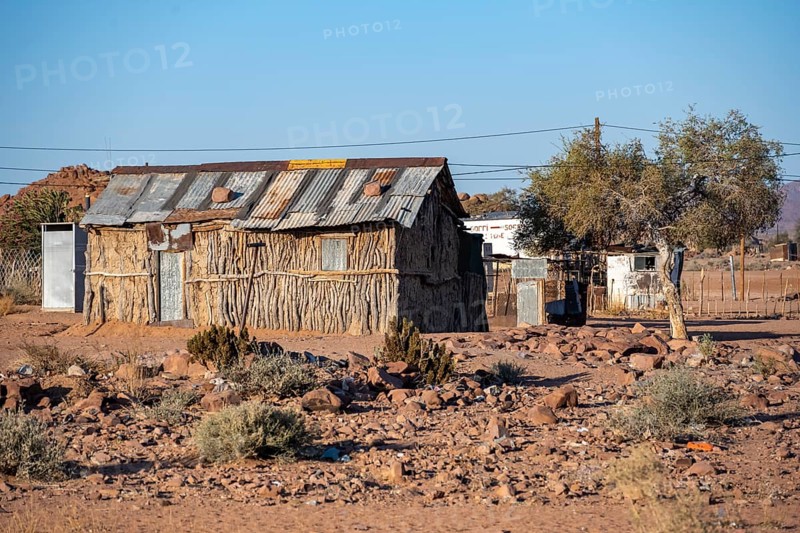 Simple house made of wood and clay in a small village, Erongo, Damaraland, Namibia
