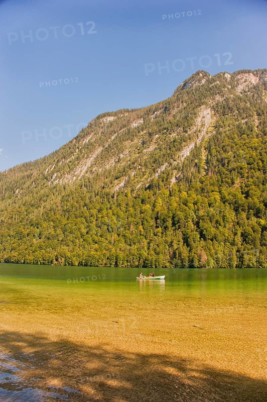 Rowing boat on the Königssee, mountain lake in the municipality of Schönau am Königssee, district of Berchtesgadener Land. Nestled between the steep slopes of the Watzmann and Hagengebirge mountains, it has a fjord-like character. It is one of the cleanest lakes in Germany. Navigation since the 18th century. Upper Bavaria, Bavaria