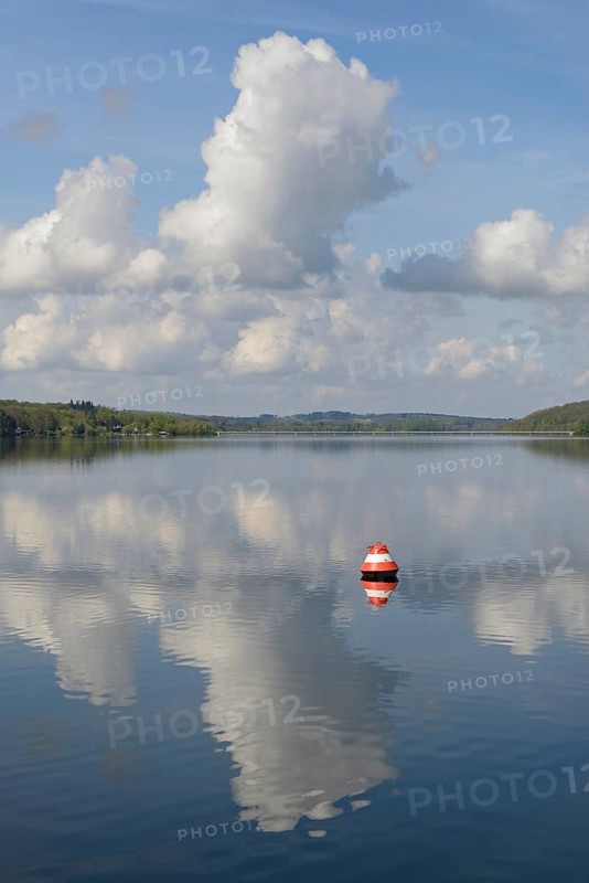 View over the Möhnesee, red and white buoy, blue cloudy sky, reflection on the water surface, Möhnetalsperre, North Rhine-Westphalia, Germany