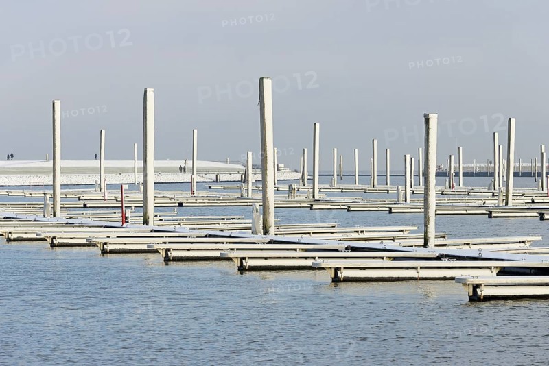 Winter day, onset of winter, snow on the jetties in the marina, North Sea, Norddeich, Lower Saxony, Germany