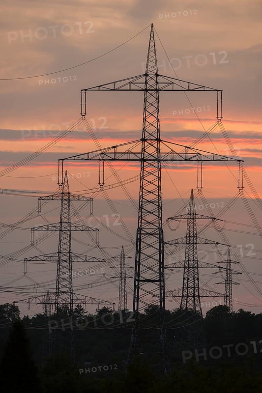 Power lines in front of a bright orange sky at sunset, Waiblingen, Baden-Württemberg, Germany