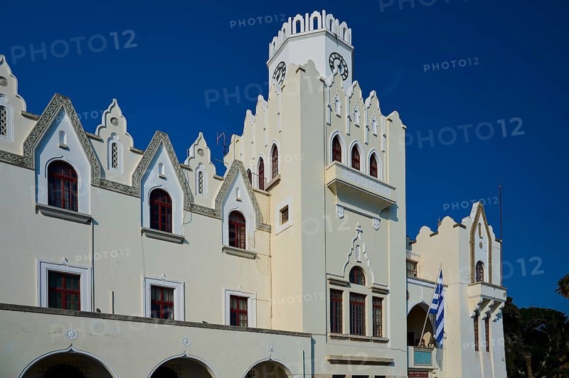 Palace of Justice, Colonial building, Historic building with decorative facade and Greek flag under a clear sky, Kos Town, Kos, Dodecanese, Greek Islands, Greece