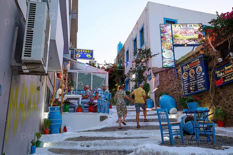 Riga Fereou, Steps of Kos, famous alley, picturesque alleyway with tavernas, colourful chairs and cosy ambience in the evening light, Kos Town, Kos, Dodecanese, Greek Islands, Greece