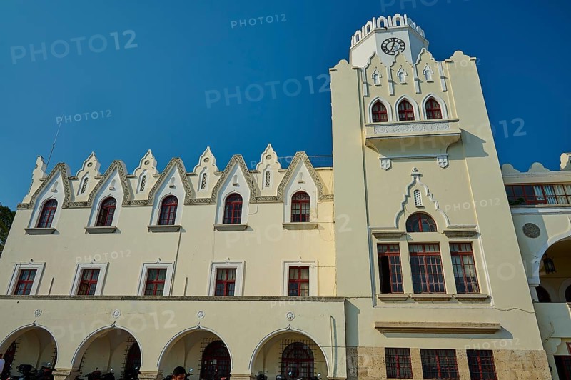 Palace of Justice, Colonial building, White building with clock tower and Gothic arches under a bright blue sky, Kos Town, Kos, Dodecanese, Greek Islands, Greece