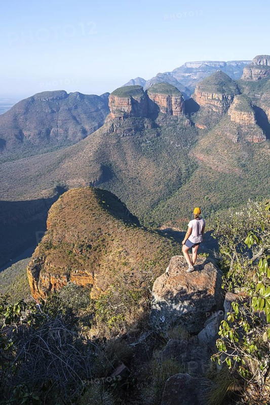 Hiker at Blyde River Canyon with Three Rondawels peak, view of canyon with Blyde River and Table Mountains, canyon landscape, Panorama Route, Mpumalanga, South Africa
