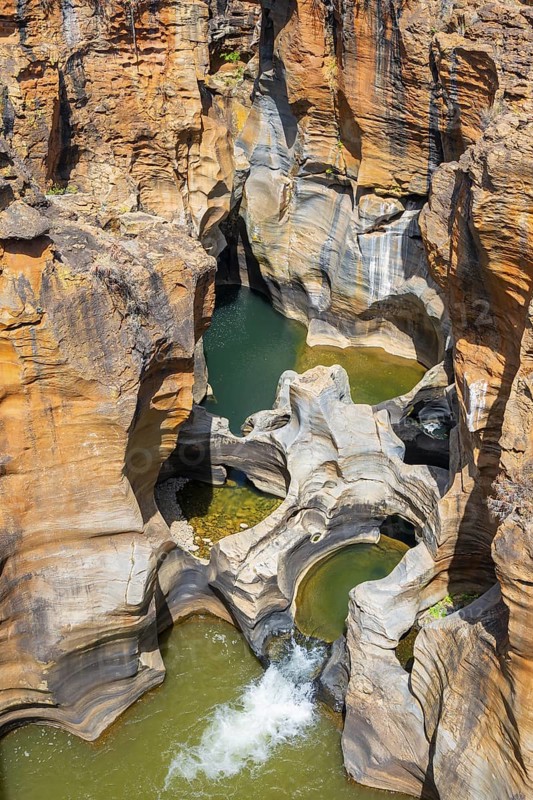 Eroded rock formations, canyon with steep orange-coloured rock cliffs with the Blyde River, Bourke's Luck Potholes, Panorama Route, Mpumalanga, South Africa