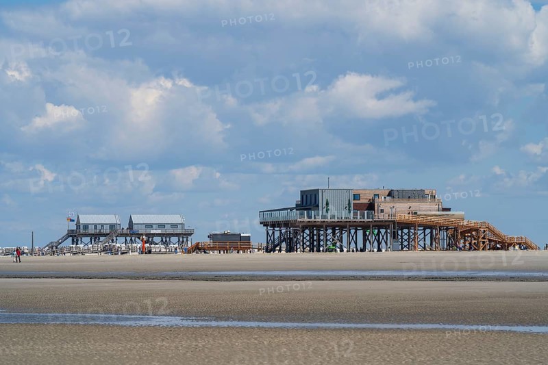 Pile dwellings on the beach, low tide, cloudy, Sankt Peter Ording, Eiderstedt, North Frisia, North Sea, Schleswig-Holstein, Germany