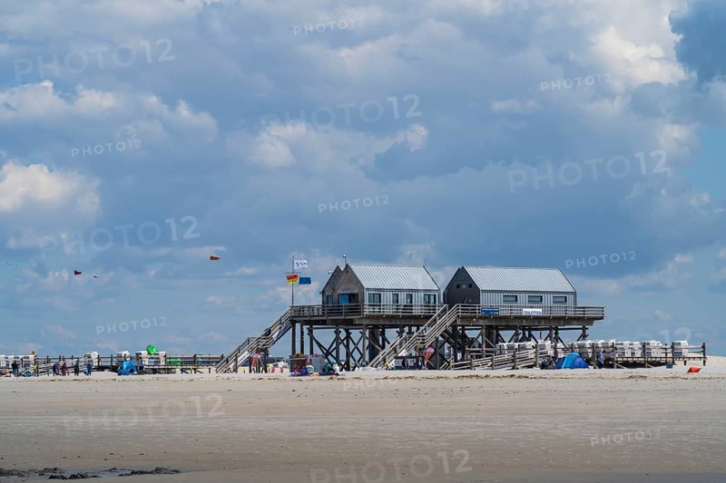 New pile dwellings on the beach with lifeguards and toilets, cloudy, Sankt Peter Ording, Eiderstedt, North Frisia, North Sea, Schleswig-Holstein, Germany