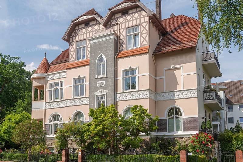 Living in the Schwachhausen district, façade of a Wilhelminian style villa, year 1904, architecture, half-timbered upper storey, corner tower, gardens, Hanseatic city of Bremen, Germany