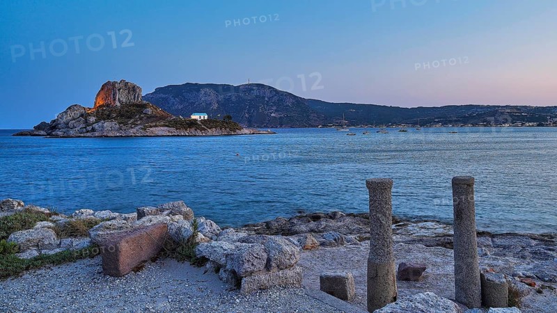 Ruins in the foreground and a calm sea with a rocky island at dusk, Agios Stefanos Beach, Agios Stefanos Basilica, Basilica, Kastri Island, Kos, Dodecanese, Greek Islands, Greece